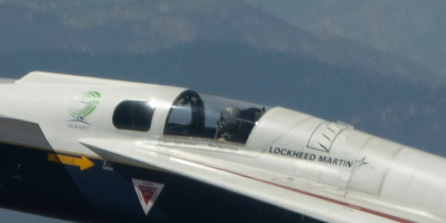 The same part of the X-59 cut from the name=orig copy, where the pilot's helmet, the logo lettering and the stencils on the fuselage are sharp